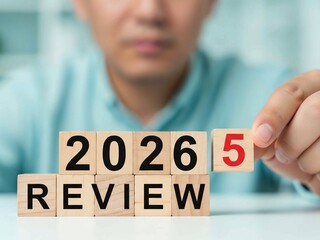 Business Review 2025 Turning Into 2026 on Wooden Blocks for Strategic Planning