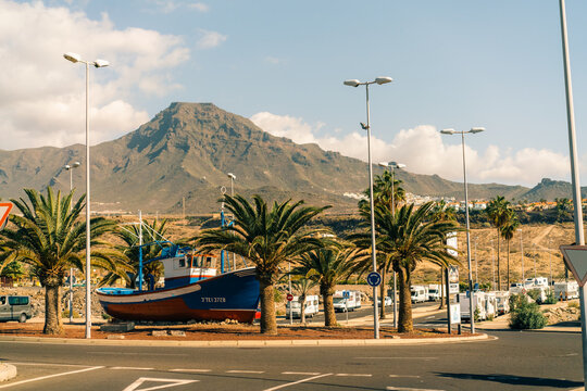 View of palm trees, and beautiful buildings of spanish architecture, in La Caleta, Tenerife, Spain - 3 dec 2025