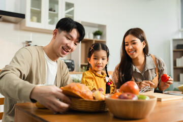 Family Asian spending happy time together on vacation, daughter homework on holiday.