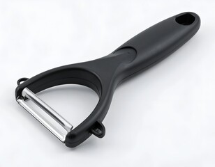 Obraz premium A black handled peeler with a silver blade, close-up against white