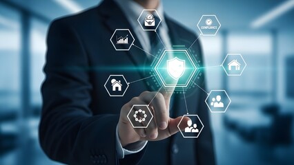 Corporate data protection and compliance concept with a businessman pointing to a virtual shield icon and security symbols