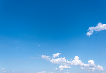 clear blue sky background,clouds with background, Blue sky background with tiny clouds. White fluffy clouds in the blue sky. 
Captivating stock photo featuring the mesmerizing beauty of the sky 