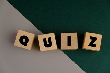the words Its Quiz on green paper. the concept of answering quizzes or quiz games