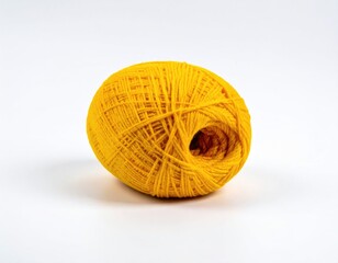 A vibrant yellow ball of yarn against a clean white backdrop