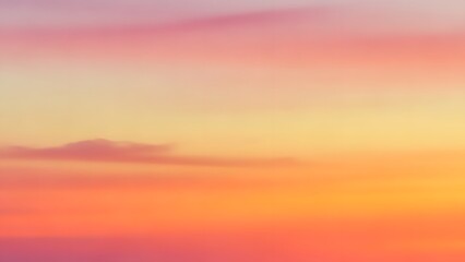 Fototapeta premium Warm abstract sunset sky gradient with soft orange yellow and pink blended clouds
