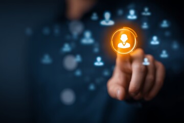 Business executive's finger selecting glowing user icon from multiple avatars on virtual interface, concept for human resource management, digital networking and talent acquisition