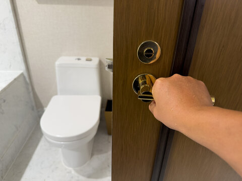 open the bathroom door, go to toilet