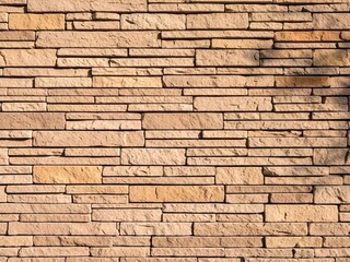 Fototapeta premium Textured Brick Wall Background with Natural Light and Shadow Details