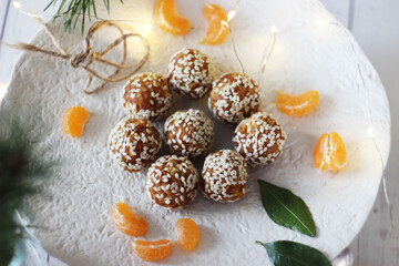 Sweet sesame balls are placed on a ceramic tray on the table