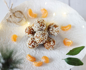 Sweet sesame balls are placed on a ceramic tray on the table