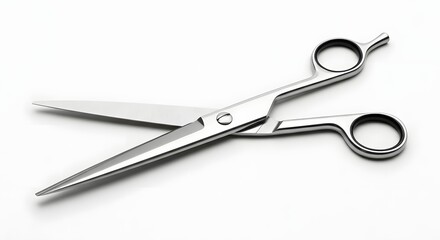 Obraz premium Professional stainless steel hairdressing shears with finger rests shown open on a clean white background emphasizing sharp precision cutting tools