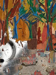 Metallic silver surfaces contrast with colorful paper trees and raked sand patterns in this collage.