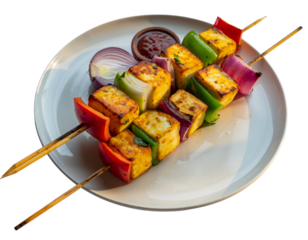 Delicious paneer tikka skewers on a plate with vegetables