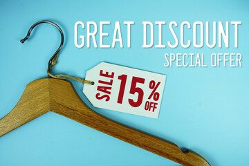 Great Discount Sale 15% off price tag label with Clothes hanger Clothing Promotion shopping concept