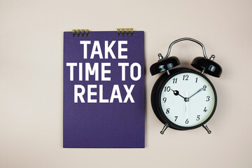 Take Time To Relax text with alarm clock on pink background