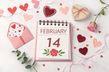 Valentine's day celebration concept featuring a desk calendar marking February fourteenth surrounded by pink hearts an open envelope a single rose and festive ribbons on a white wooden surface represe