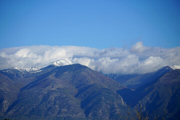 Autumn mountain landscape rocks stones clear day blue sky clouds snow top walk tourism forest flora nature panorama