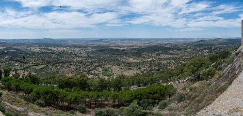 Naklejka premium Panoramic landscape view with rolling hills and trees