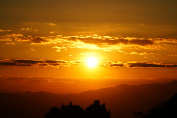 Golden Sunrise Over Misty Mountain Layers