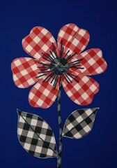 Obraz premium Red Gingham Flower on Blue Background
