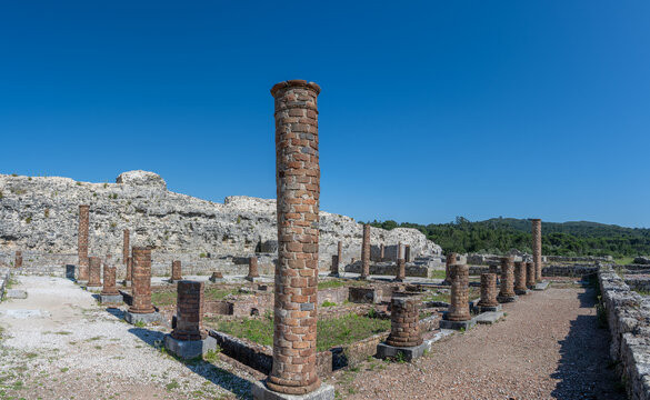 Ancient ruins of Conimbriga, Portugal with brick columns under blue sky