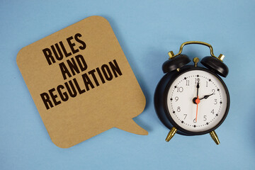 Rules And Regulation text with alarm clock on blue background