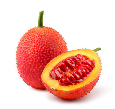 Gac fruit with half cut isolated on white.
