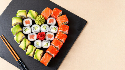 Heart-Shaped Sushi Platter for a Romantic Meal. Sushi on beige background, top view, text space