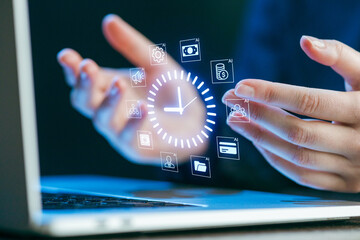 Hands engaging with virtual icons above a laptop screen, illustrating technology and time management concepts during a brainstorming session