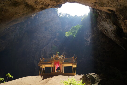 Sunlight falls on the temple in the cave.