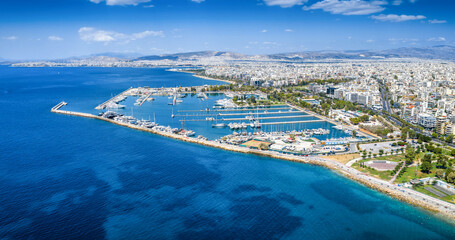 Panoramic aerial view of the Alimos district in southern Riviera in Athens, Greece, with boat marina and beaches next to the urban skyline