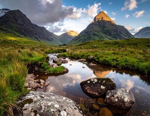 Majestic Mountain Peak Lit by Golden Sunlight and Stream
