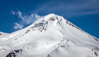 Majestic Snowy Mountain Peak Under Bright Blue Sky