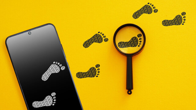 Digital Footprint Tracking Concept - Smartphone with Footprints and Magnifying Glass. Online Privacy, User Data Monitoring and Cyber Security - Powered by Adobe