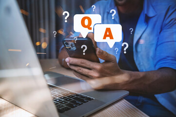 Customer Support and FAQ Concept, Man Using Smartphone with Digital Q&A Speech Bubbles, representing online consulting, customer service, frequently asked questions, and mobile communication support.