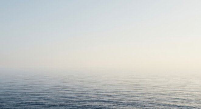 The ocean horizon forms a smooth, gentle curve under a pale, diffused sky, emphasizing the planet's vast, spherical, and continuous nature ,environment ,ocean ,curved
