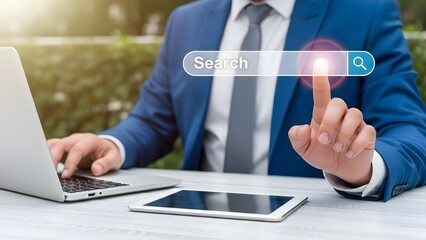 Businessman searching online with digital devices on a table