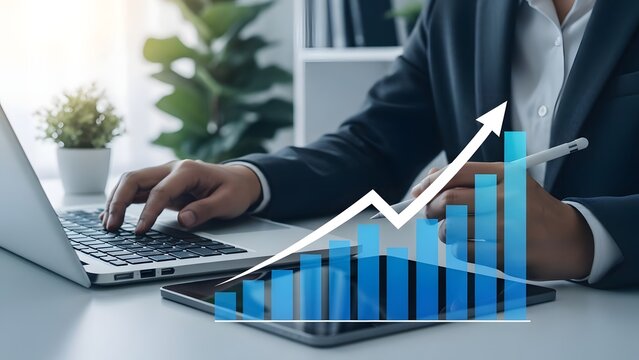 Businessman analyzing data on laptop with increasing graph and statistics - Powered by Adobe