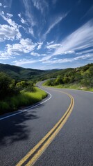 Fototapeta premium Winding Road Through Green Hills Under a Cloudy Sky