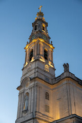 Fototapeta premium Illuminated church tower at dusk