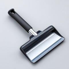 Car ice scraper with rubber grip for winter car maintenance isolated on white background