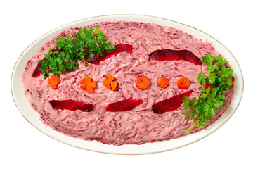 A dish with herring salad under a fur coat on a white background. Holiday salad isolated