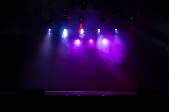 scene, stage light with colored spotlights and smoke