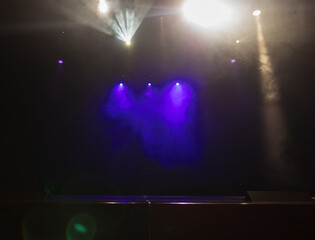 scene, stage light with colored spotlights and smoke