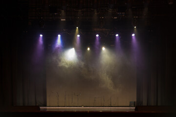 scene, stage light with colored spotlights and smoke