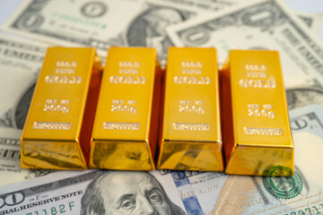 Gold bar on US dollar and Euro banknote, economy finance exchange trade investment.