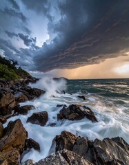 Obraz premium Stormy Sky over Crashing Waves on Rocky Coast