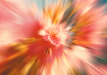 Abstract floral explosion with radial zoom motion blur effect featuring soft pink and orange petals spreading from center for energetic background
