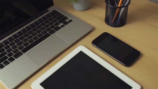 Modern workspace with laptop and mobile devices