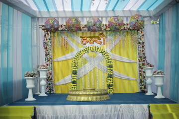 Beautifully decorated wedding venue featuring elegant floral arrangements, soft ambient lighting,...